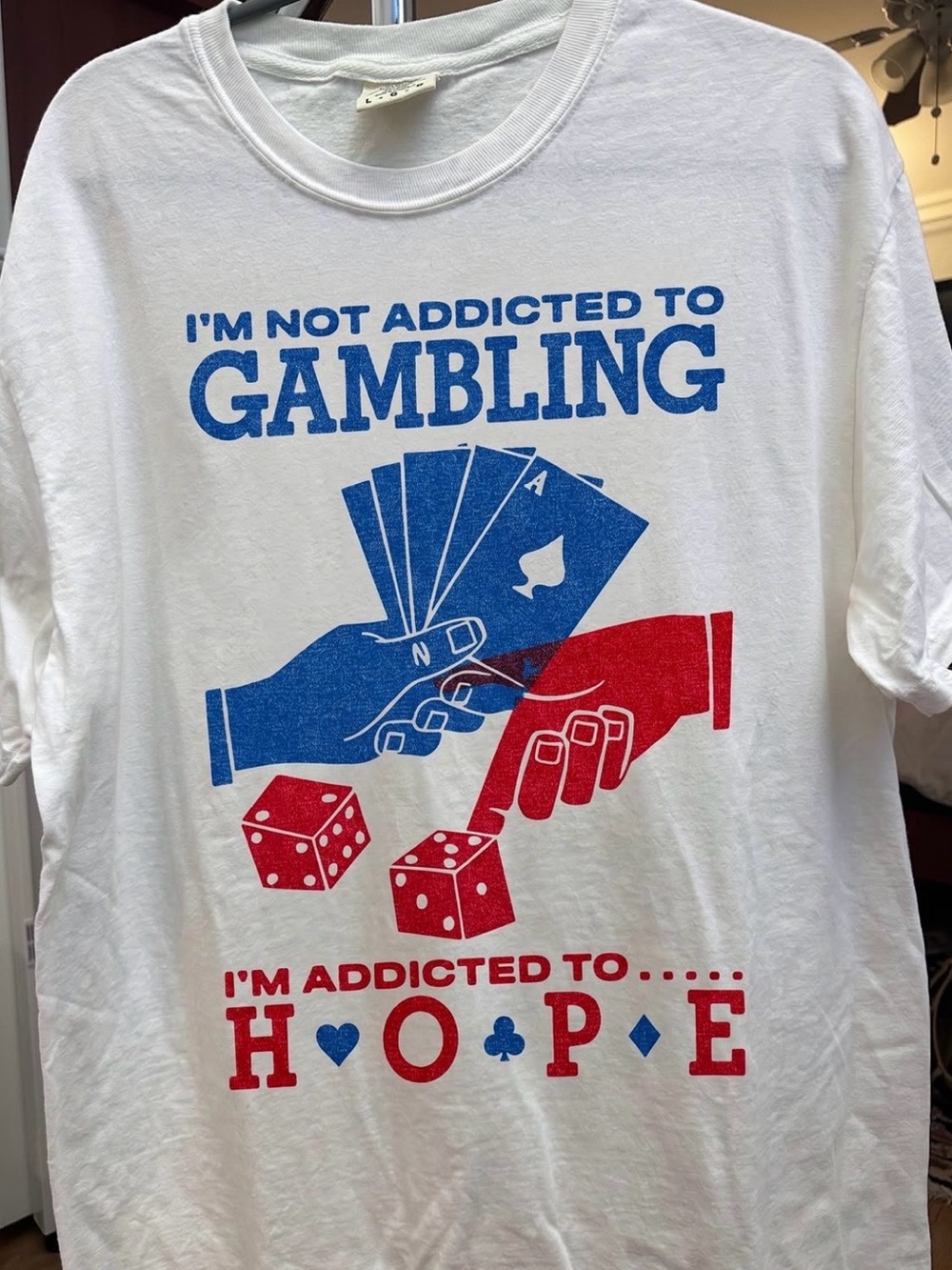 I'm Not Addicted to Gambling – White T-Shirt with Red & Blue Graphic